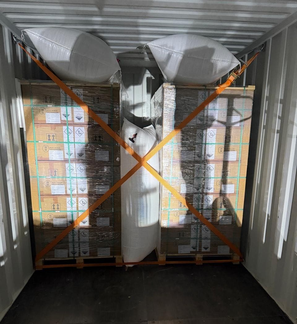 Palletized bromine cartons secured and loaded into an export container
