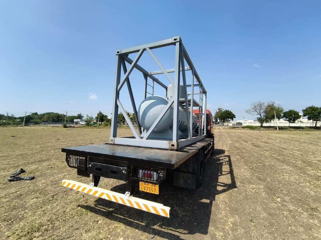 Rear view of a dispatch truck loaded with a bulk tank unit